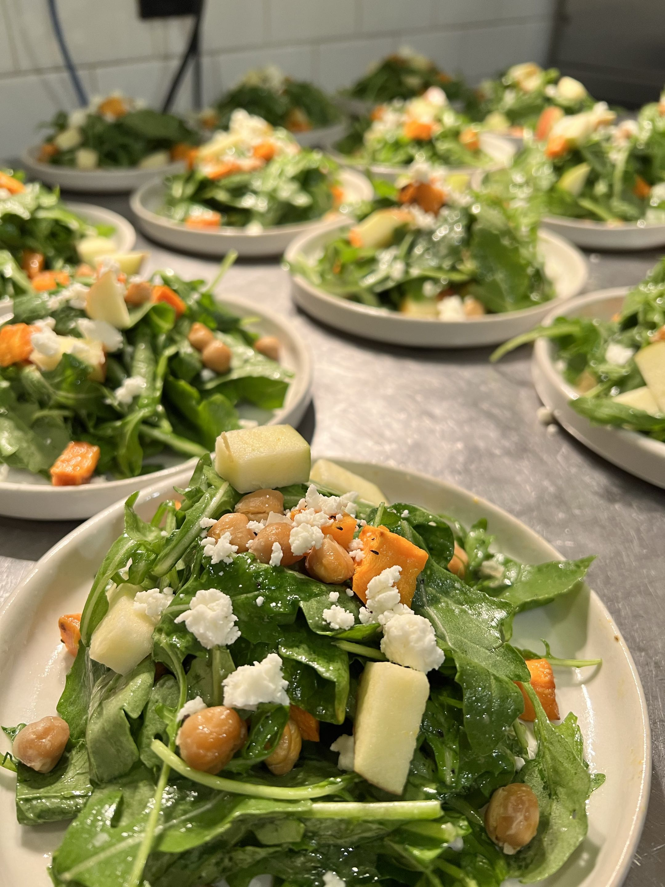 Plated salad service on trays