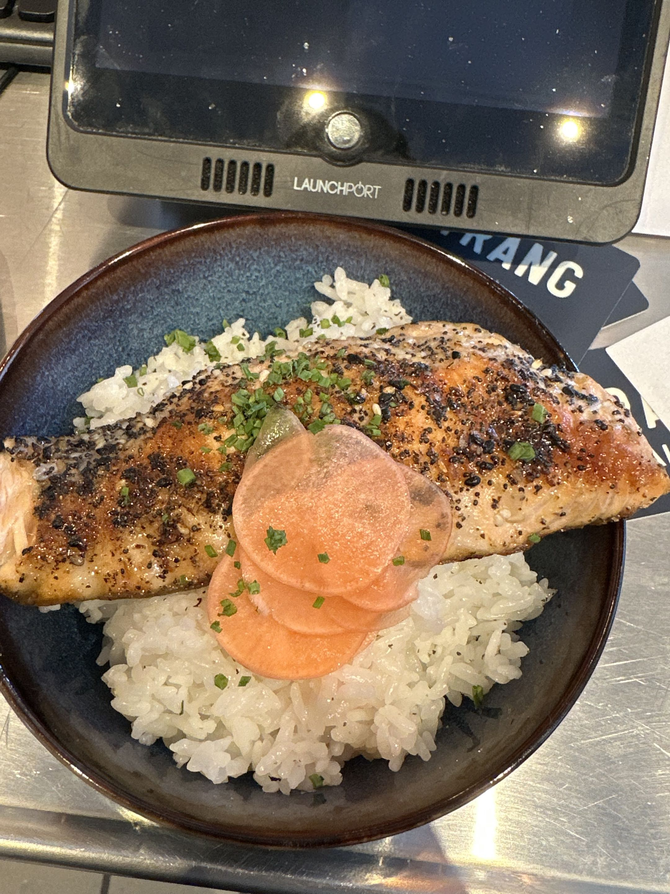 Grilled salmon over rice